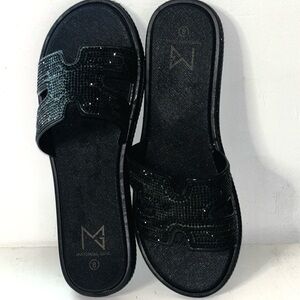Material Girl Black Sparkly Slide
Sandals